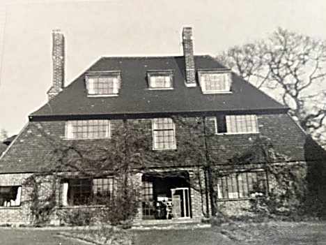Bullens Lee house, a large brick home with ivy and multiple chimneys